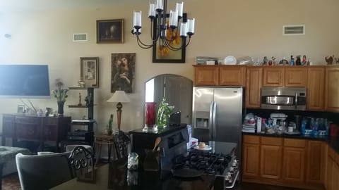 Living area, kitchen and dinning are open concept with high ceilings.