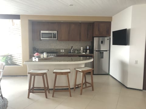 kitchen with all that you will need an island with TV