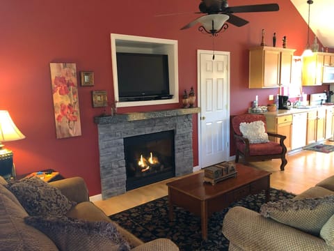 Seating for 6 in this cozy living room with fire place & 42-inch SMART LCD TV
