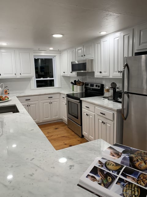 Long view of kitchen at night.