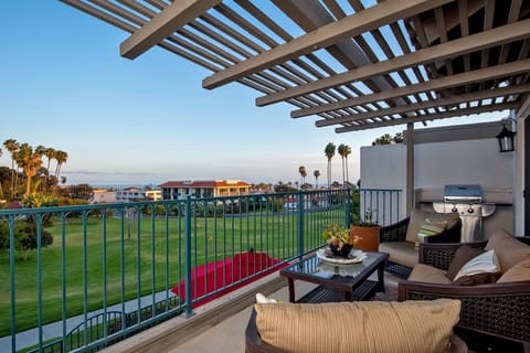 This condo has a nice patio off the family room with bque, seating, and views.