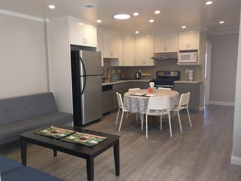 Spacious Living Room & Kitchen – Fully equipped for your convenience.