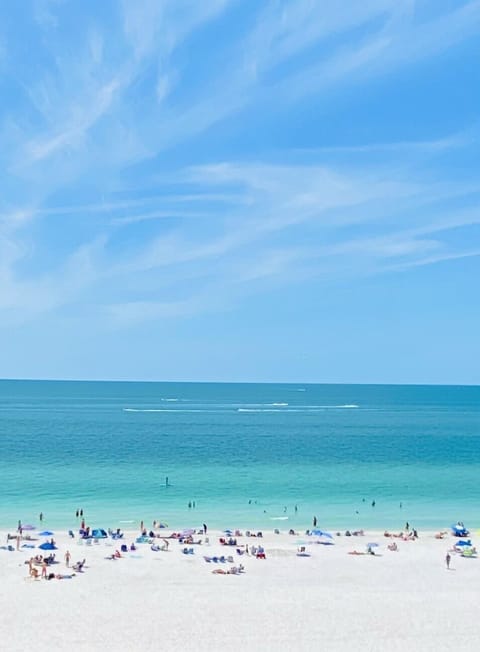 On the beach, sun loungers, beach towels