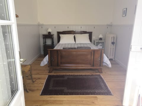 Main bedroom,  vintage French furniture ,  with comfortable modern bedding! 