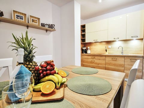 Cabinetry, Property, Food, Furniture, Countertop, Table, Interior Design, Wood, Lighting, Kitchen