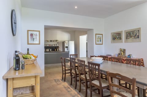 Kitchen dining area with basaltina stone table that seats 12