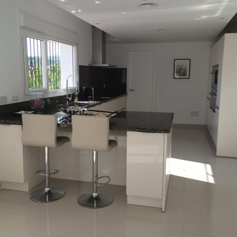 Kitchen - fully fitted with marble worktops.  Double ovens, etc