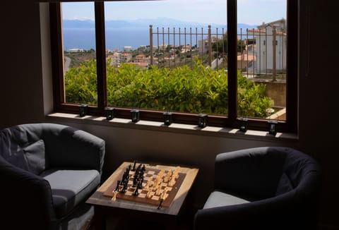 The main living-room - play chess, enjoy your drink or bothwith a nice sea-view