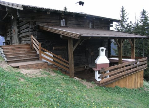 A summer photo with the covered terrace and barbecue