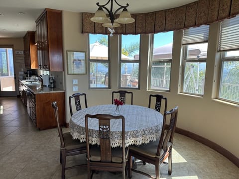 Bright Breakfast nook off of kitchen, seats up to six