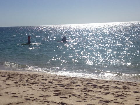 On the beach, sun loungers, beach towels