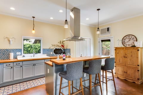 The breakfast bar is perfect for visiting or can be used as a work space.