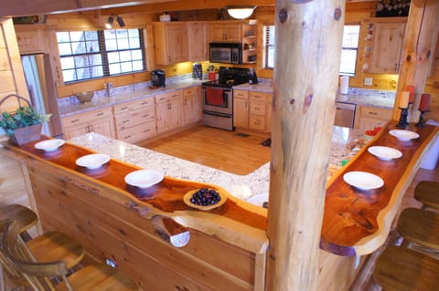 Granite counter tops and beautiful large natural cedar wood bar that seats 6.