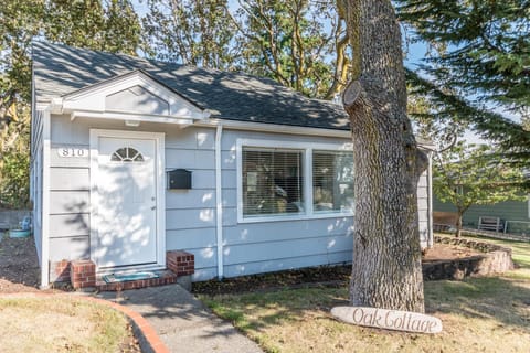 Front of cottage & surrounded by the protected Oak Trees. 