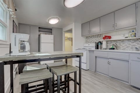 Spacious kitchen open to front living room. Coffee maker, toaster, kettle, etc