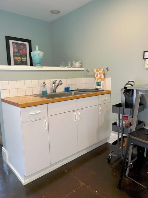 Wet bar (not full kitchen) for reheating leftovers or snacking.