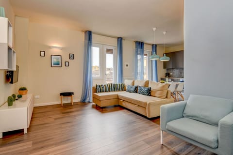 Large living room with a comfortable sofa bed and Smart TV