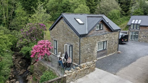 Riverside Cottage with Rhododendron in Bloom