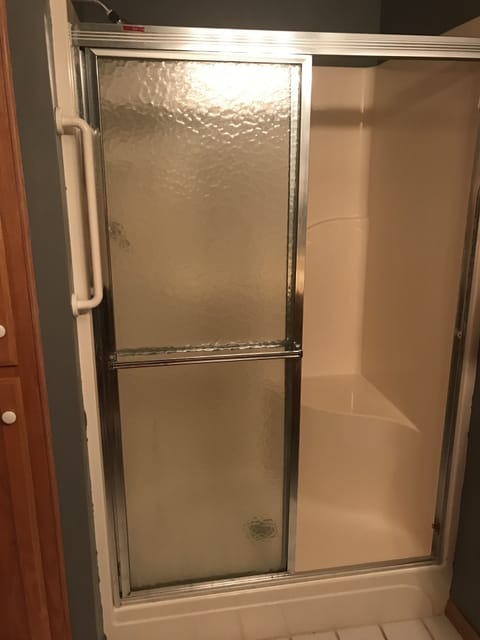 Combined shower/tub, hair dryer, towels, soap