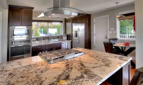 Granite counter tops and high end appliances throughout kitchen
