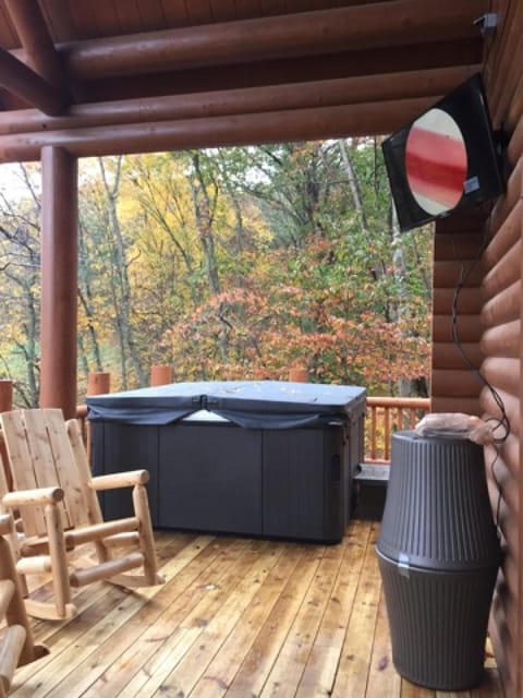 Hot tub, outdoor television, rockers and patio furniture