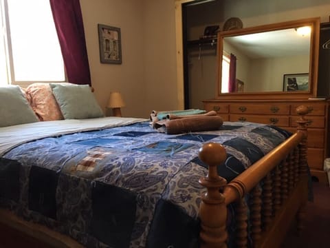 Full size bed and dresser, denim comforter in the photo. The bed covers change