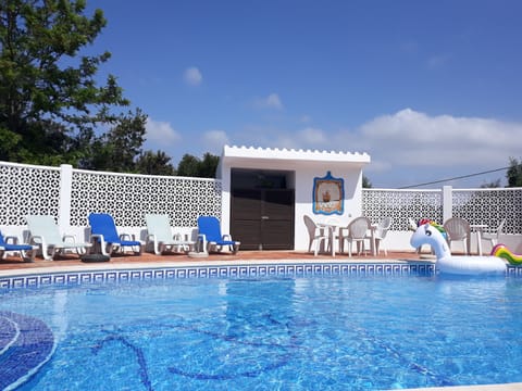 Outdoor pool, a heated pool, sun loungers