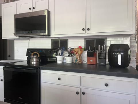 Modern kitchen with bright white cabinets.