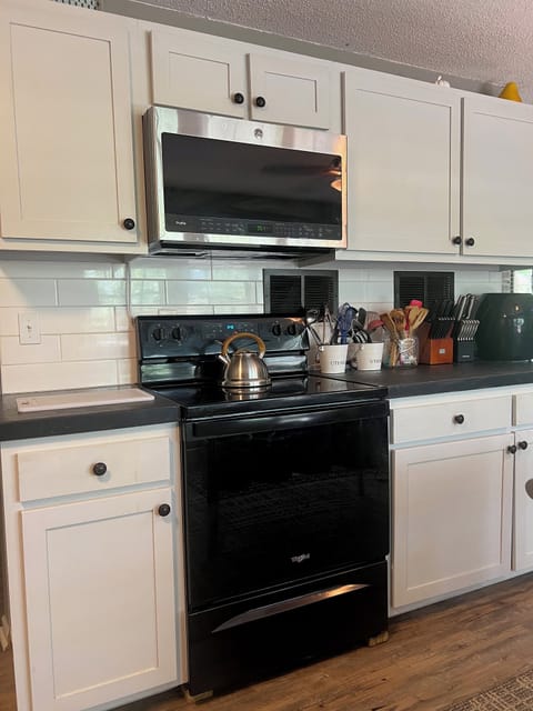 Fully equipped kitchen with stainless appliances.