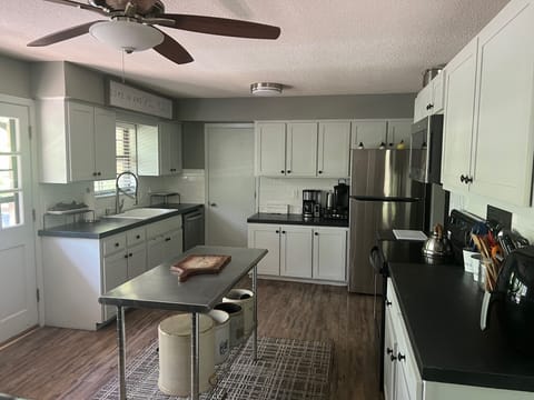 Open kitchen and dining area for gathering.
