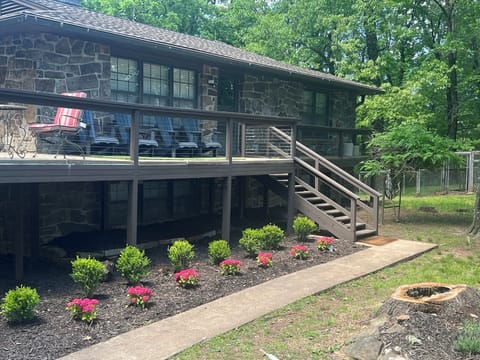 Charming cabin porch with peaceful wooded views.