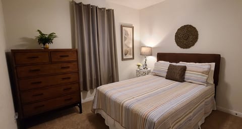 Front secondary bedroom with queen size bed.