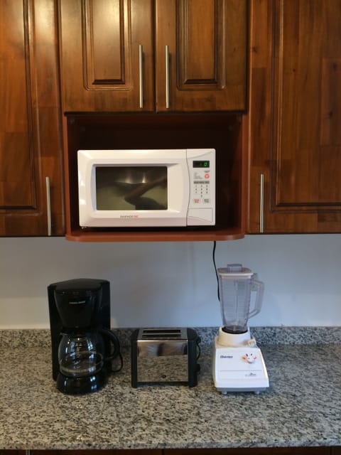 Fridge, microwave, stovetop, coffee/tea maker