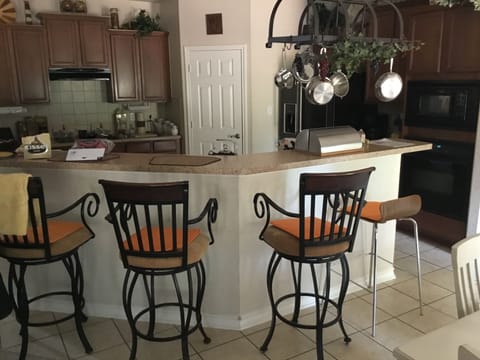 Kitchen counter bar and stools.