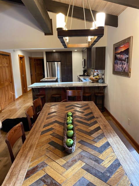 Large dinning table seats 10-12. 5 Counter bar stools.