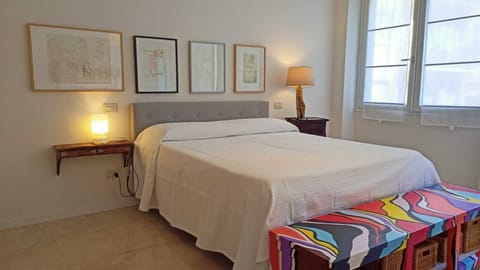 master bedroom, with large double bed, closets and dresser