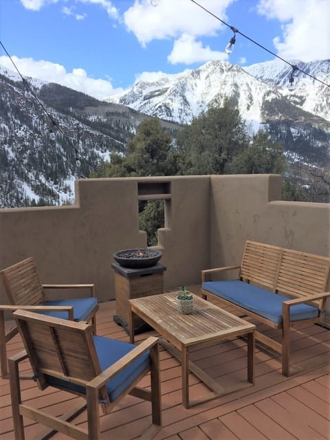 Open, spacious deck with fire pit and comfy seating