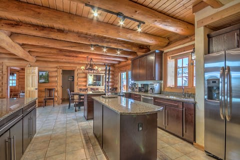 Fully equipped gourmet kitchen, breakfast area with deck