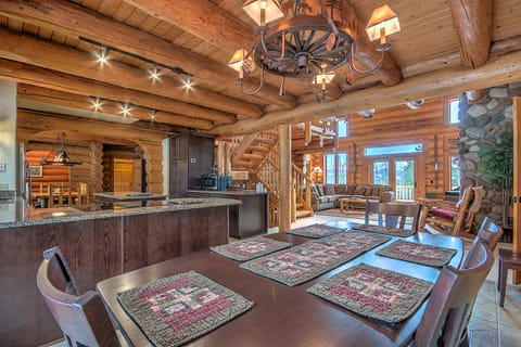 Fully equipped gourmet kitchen open to the living room with the fireplace