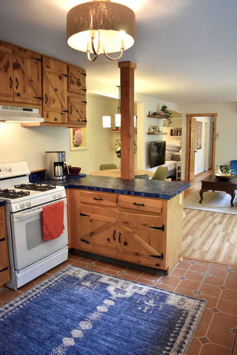 Cool original kitchen, handmade oak cabinets and tile floor. Lots of character.