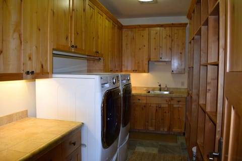 Laundry room - Newer oversized LG Washer/Dryer complete with Soap for your use
