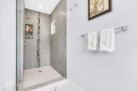 Combined shower/tub, hair dryer, towels, soap