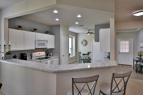 Breakfast Bar for Extra Seating or Serving Bar! Easy-care Quartz Counters!