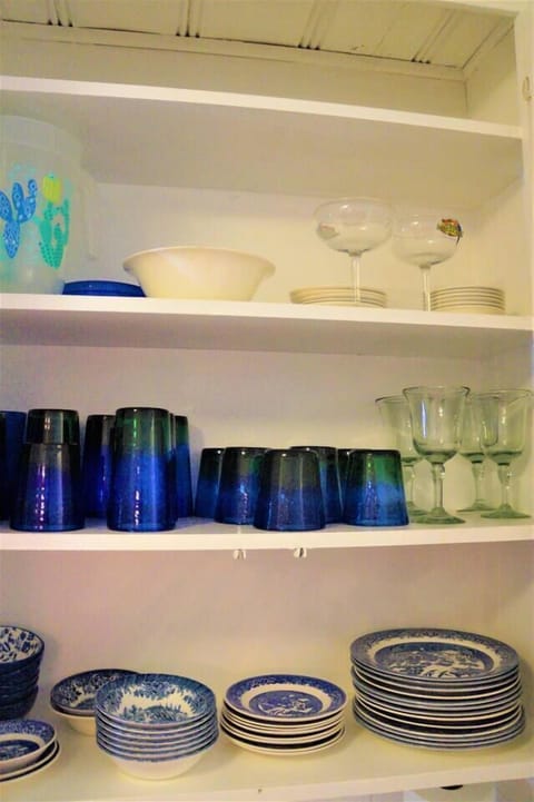 Enjoy dining on vintage Blue Willow china and drinking out of Mexican blue & green glassware.