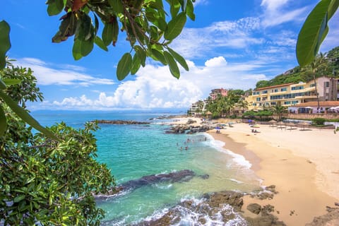 On the beach, sun loungers, beach towels