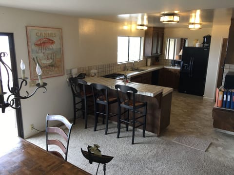 Kitchen with dual ovens, microwave, ice maker, clam steamer & more in pantry.