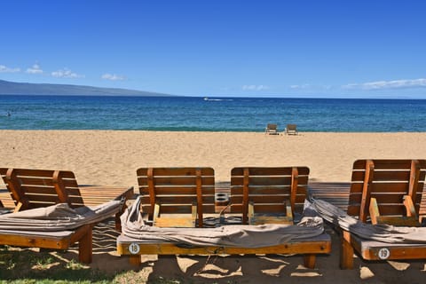 On the beach, sun loungers, beach towels