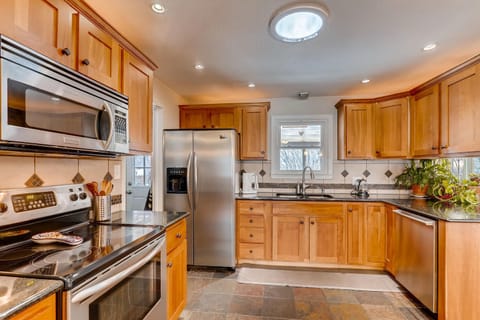 Cherry wood cabinets, and a solatube skylight keeps it bright.