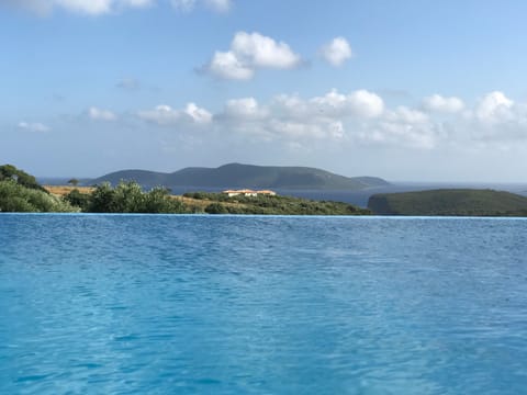 An infinity pool, sun loungers