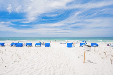 On the beach, sun loungers, beach towels